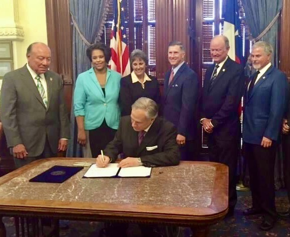 Todd at Governor Abbott’s signing ceremony for seawater desalination legislation in 2015.